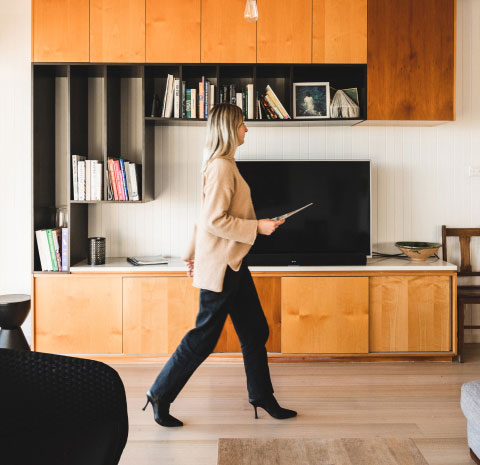 office space with blonde woman walking across floor